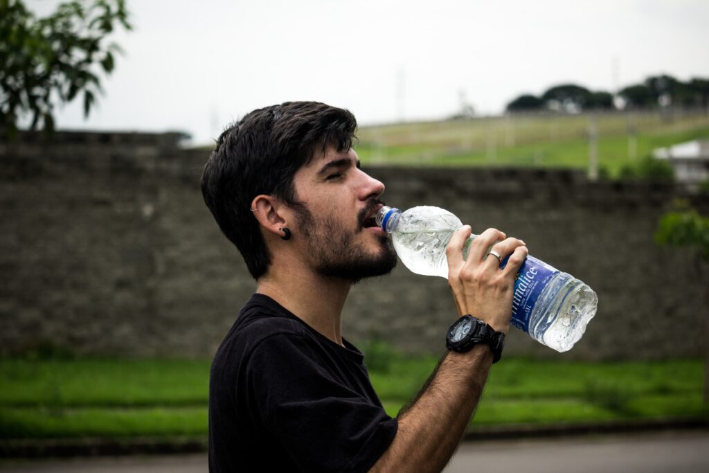 Picture showing a man drinking water 